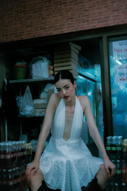 Woman Sitting in White Dress