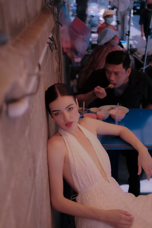 Woman with Black Hair Sitting at Table