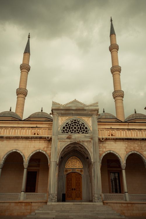 Free Sabancı Central Mosque with its stunning Ottoman architectural details and minarets, under a dramatic sky. Stock Photo