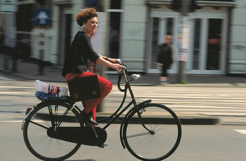 Woman on Bike on Street