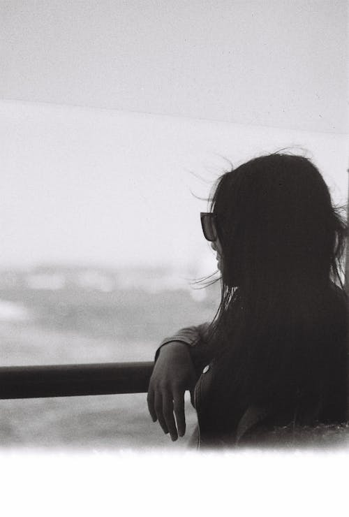 Back View of Woman on Sea Shore in Black and White