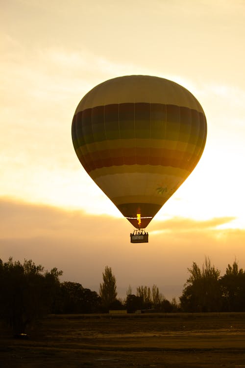 Hot Air Balloon Flying at Sunset