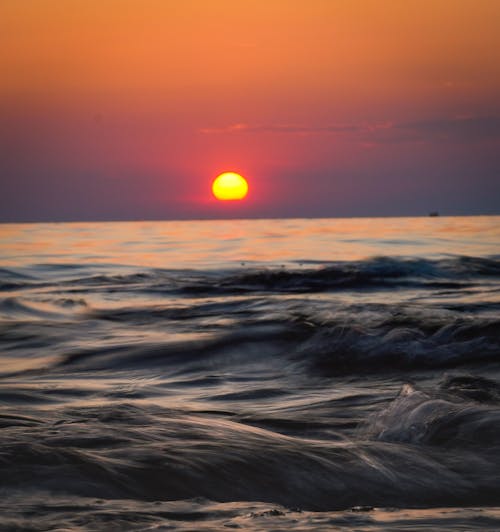 Waves on Sea Shore at Sunset