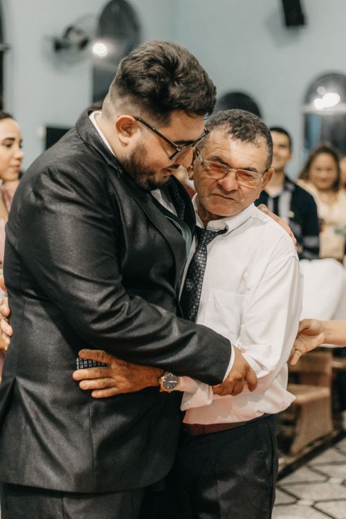 Free Father and son share a heartfelt embrace during a wedding celebration. Stock Photo