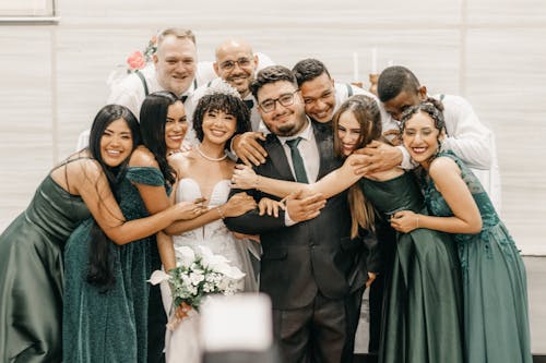 Newlyweds and Guests Smiling Together