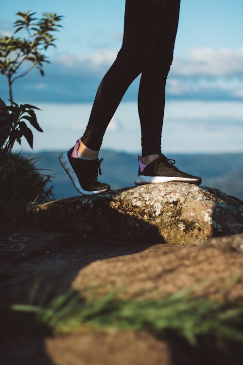 Free Person Standing On Rock Stock Photo