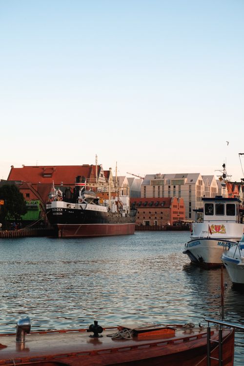 Free Charming harbor scene on the Motława River with historical ships and architecture in Gdańsk, Poland. Stock Photo