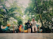 Man and Woman Holding Cameras