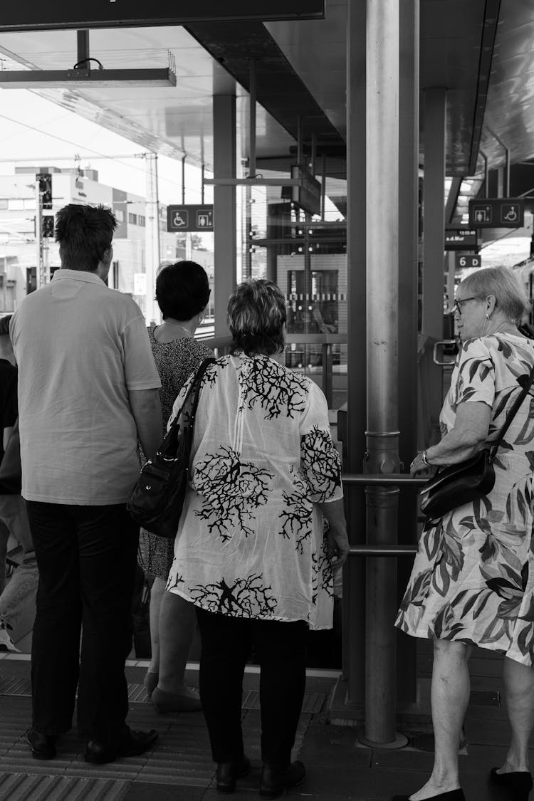 People Standing Near Closed Door Of Building