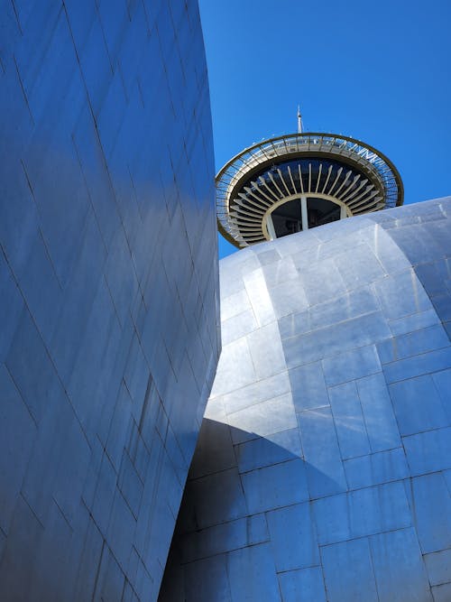 Low Angle Shot of the Museum of Pop Culture Facade and the Space Needle seen in the Background 