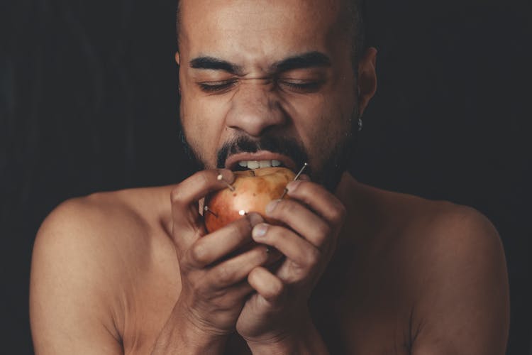 Man Biting Apple Fruit