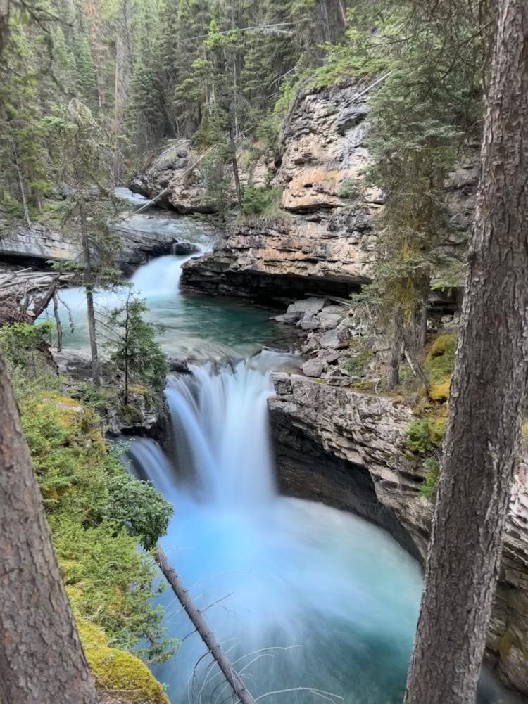 Waterfall On Stream In Forest In Banff National Park In Canada