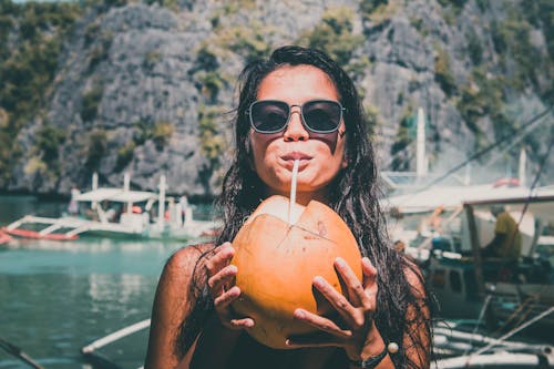 Free Photo of Girl Drinking Coconut Stock Photo