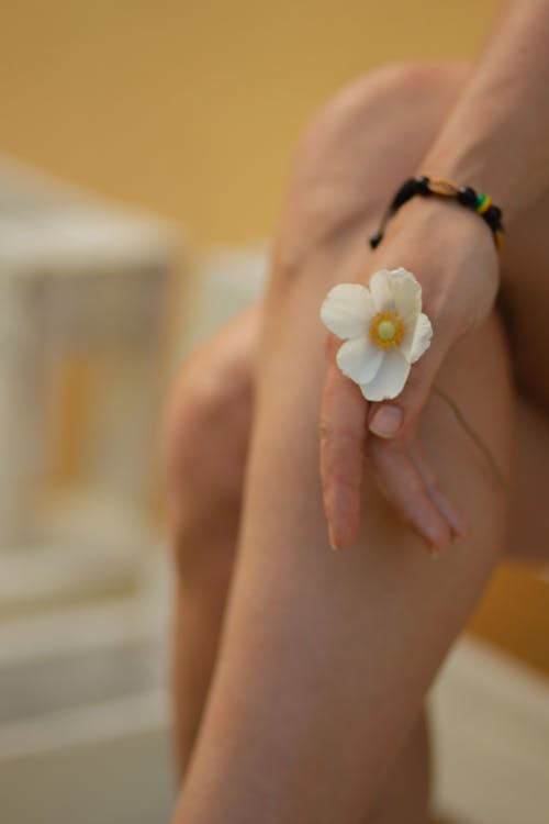 Close-up of Woman Holding a White Flower