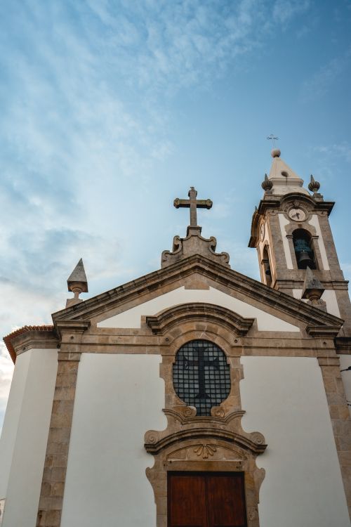 Free Captivating facade of a historic church in Vila Nova de Gaia, Porto, Portugal against a clear sky. Stock Photo