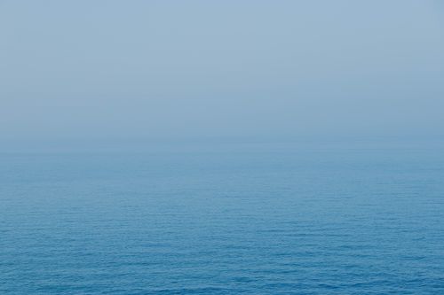 Free Calm ocean view with a hazy horizon, captured in Weihai, Shandong Province, China. Stock Photo