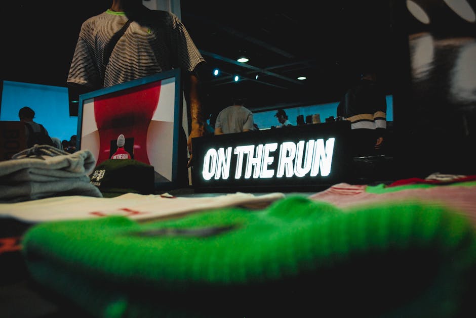Fashion model poses near high-end clothing on a modern modular display system