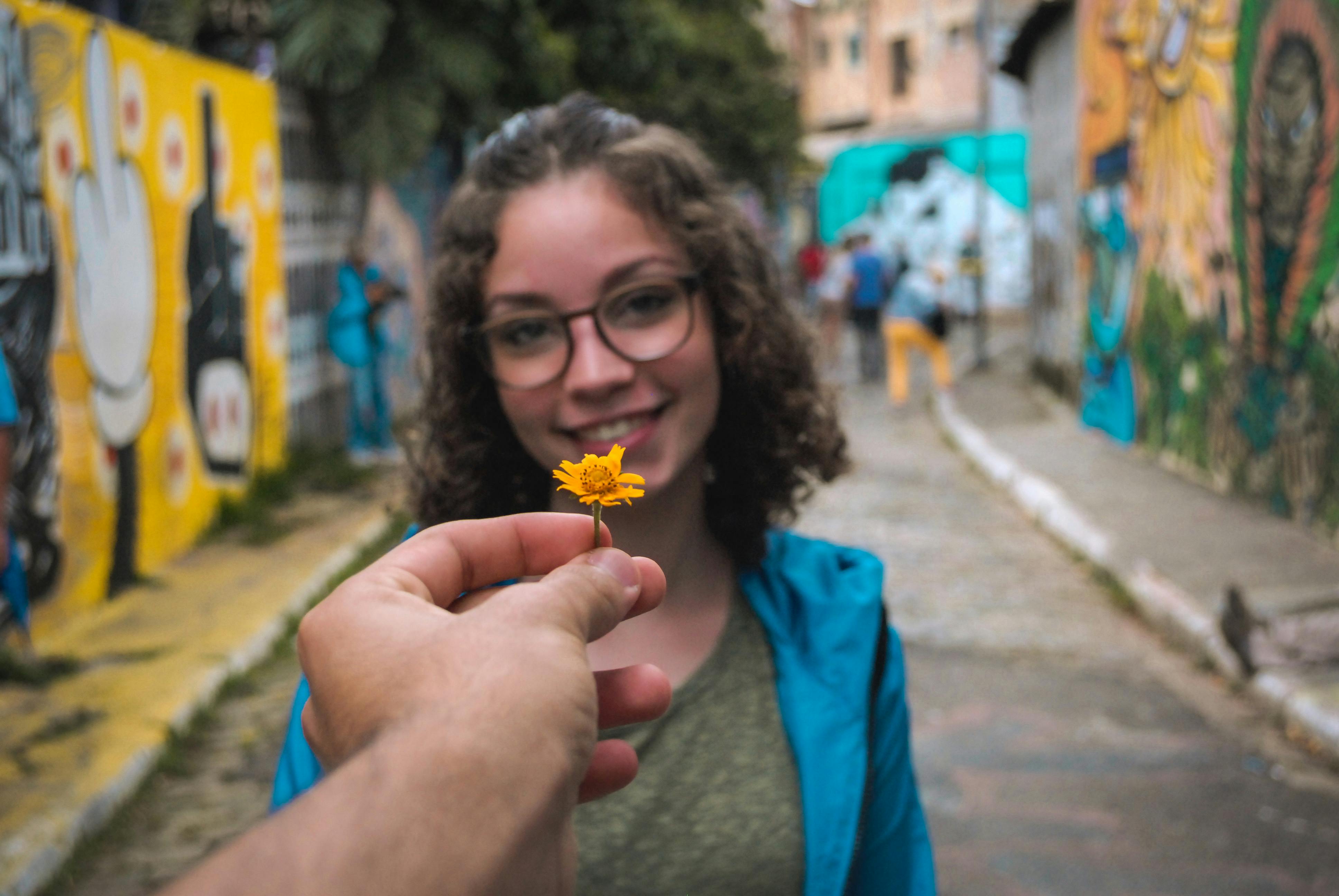 Photo of Person Giving Flower To Girl · Free Stock Photo