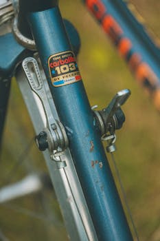 Detailed view of a vintage Peugeot bicycle frame showcasing gear levers, captured in London.