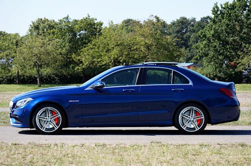 Blue Mercedes-Benz Car Parked on a Rural Road