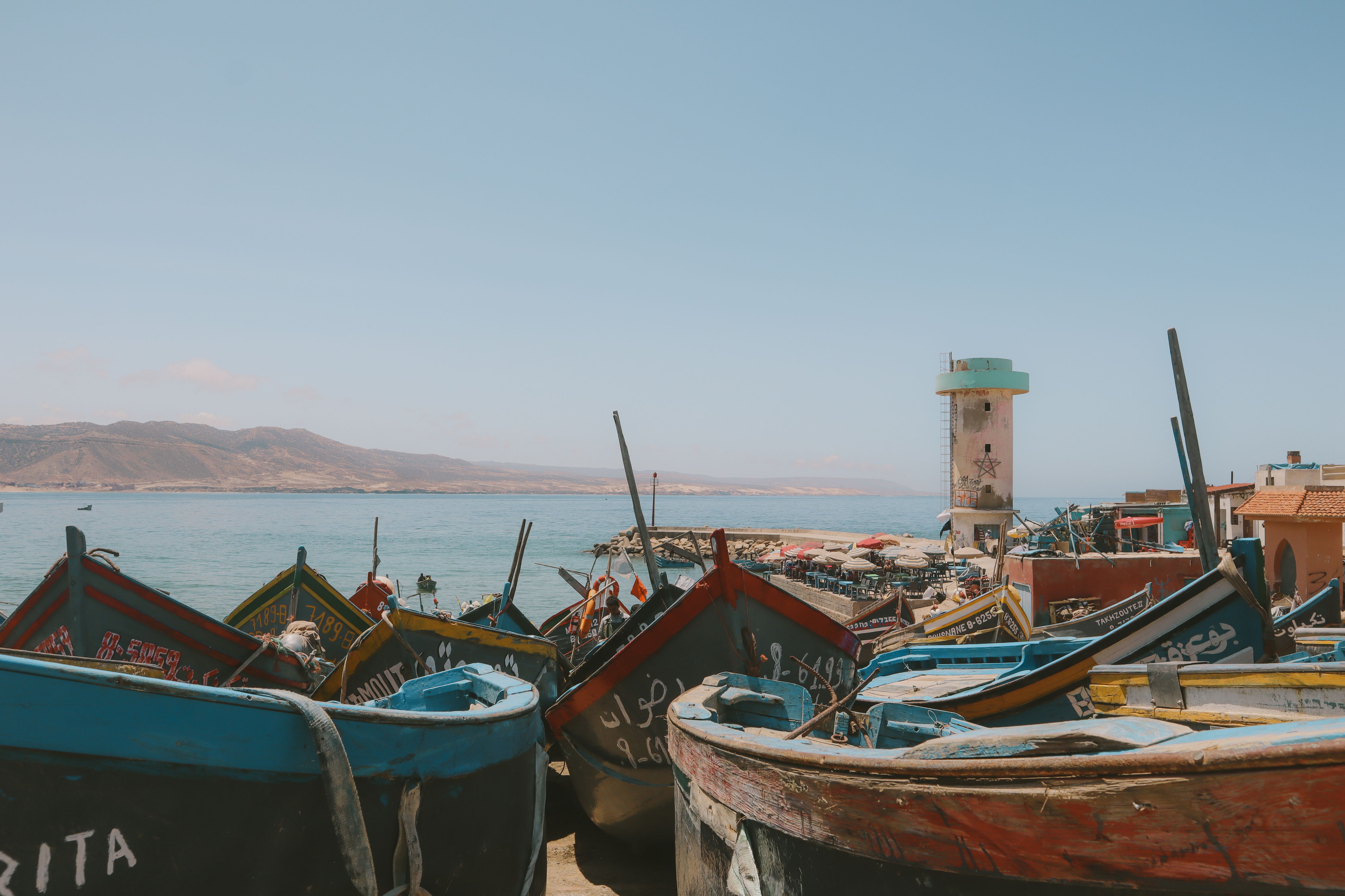 Vibrant fishing boats along the picturesque coast of Imsouane, Morocco. - Mequinez