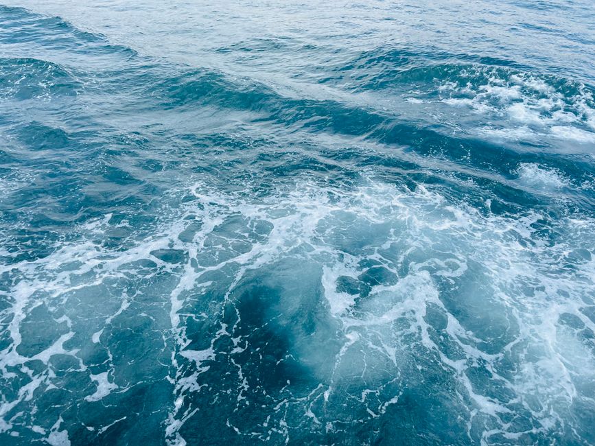 Vibrant turquoise waves rolling on the Bosphorus in Istanbul, capturing the essence of the sea's movement.