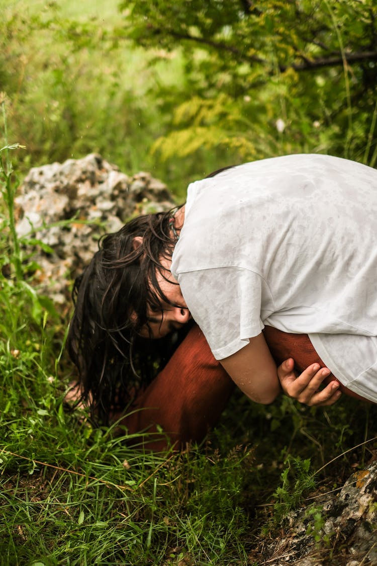 Young Woman In White T-shirt Posing In A Garden