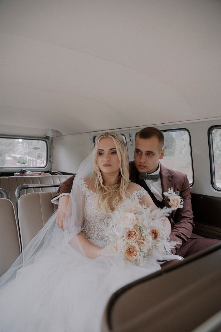 Portrait Of Bride And Groom In Van