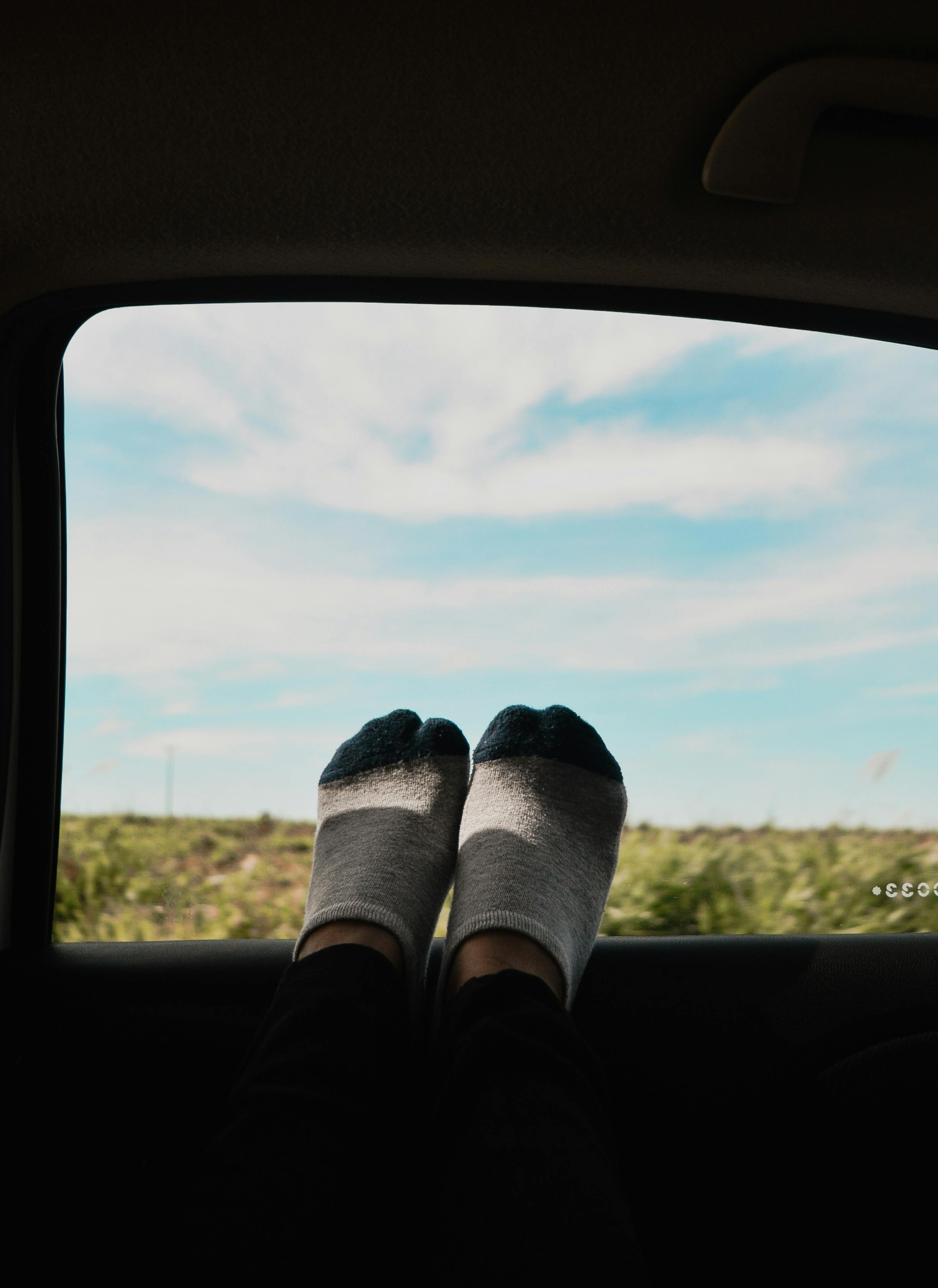 Feet On Car Window