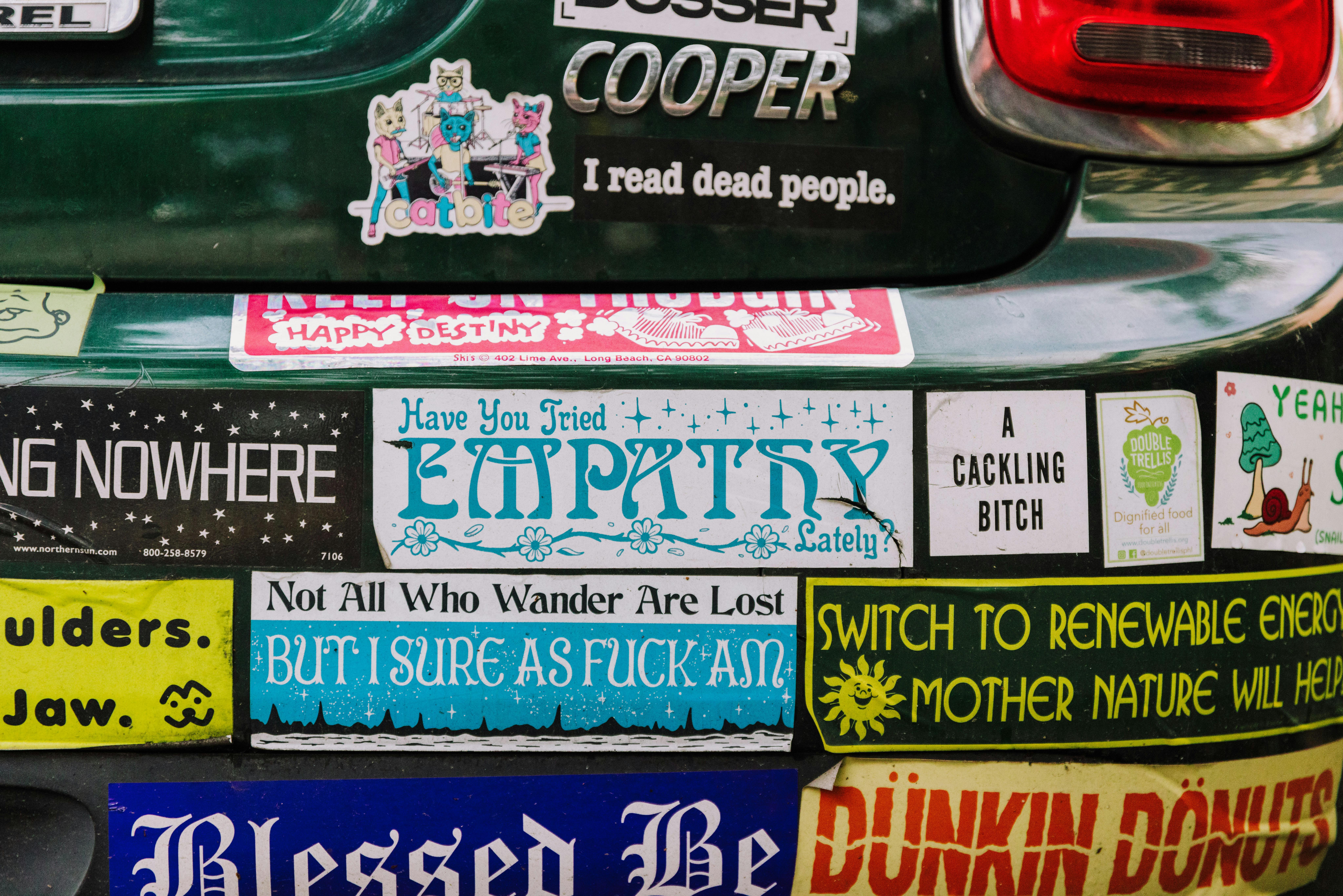Rear Bumper of a Car Covered with Colorful Stickers · Free Stock Photo