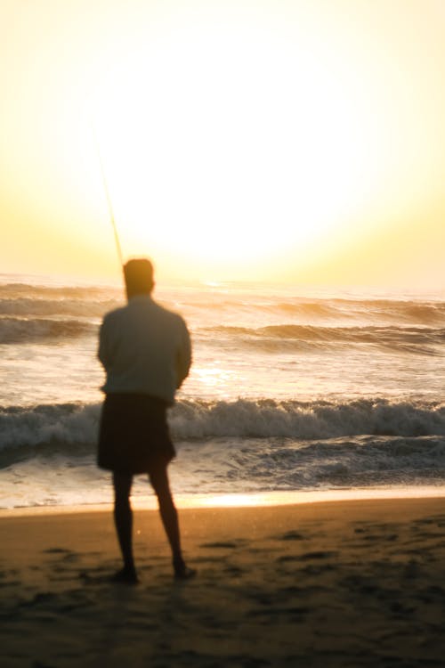 Tourist on the Beach at Sunset