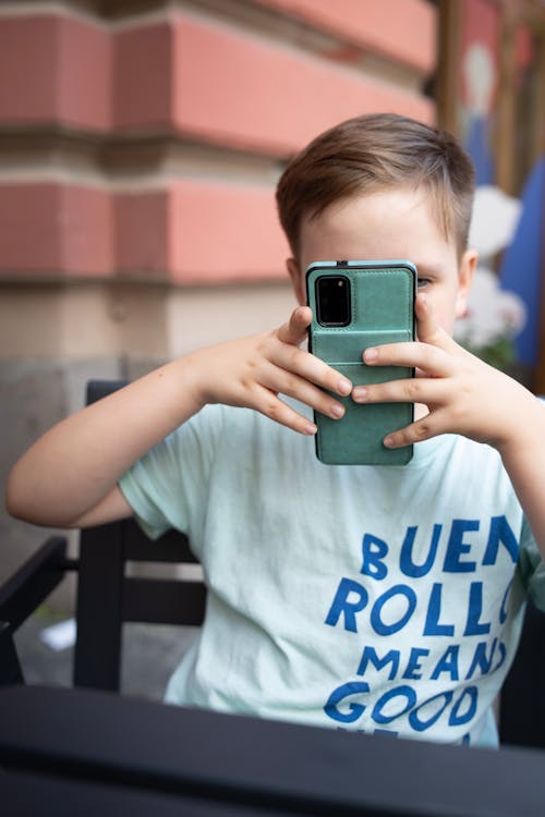 Boy Taking Photo with Smartphone