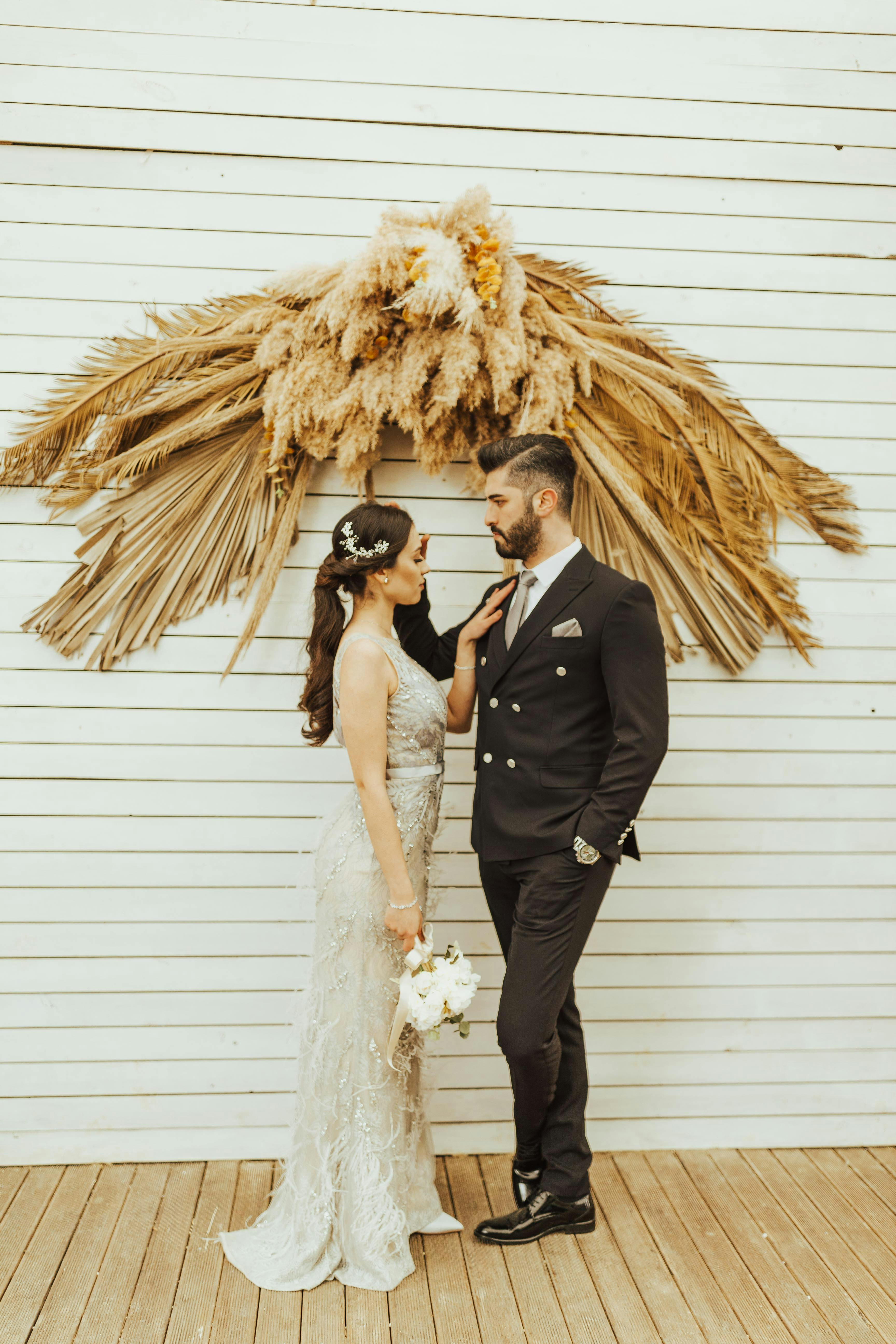 Handsome elegant bearded groom in checkered suit is standing on the bridge  in the forest. Stylish wedding grooms photo in brown leather shoes. Rustic  hipster portrait. 7101260 Stock Photo at Vecteezy