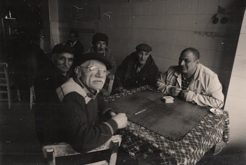 Vintage Photograph of Men Sitting at a Table