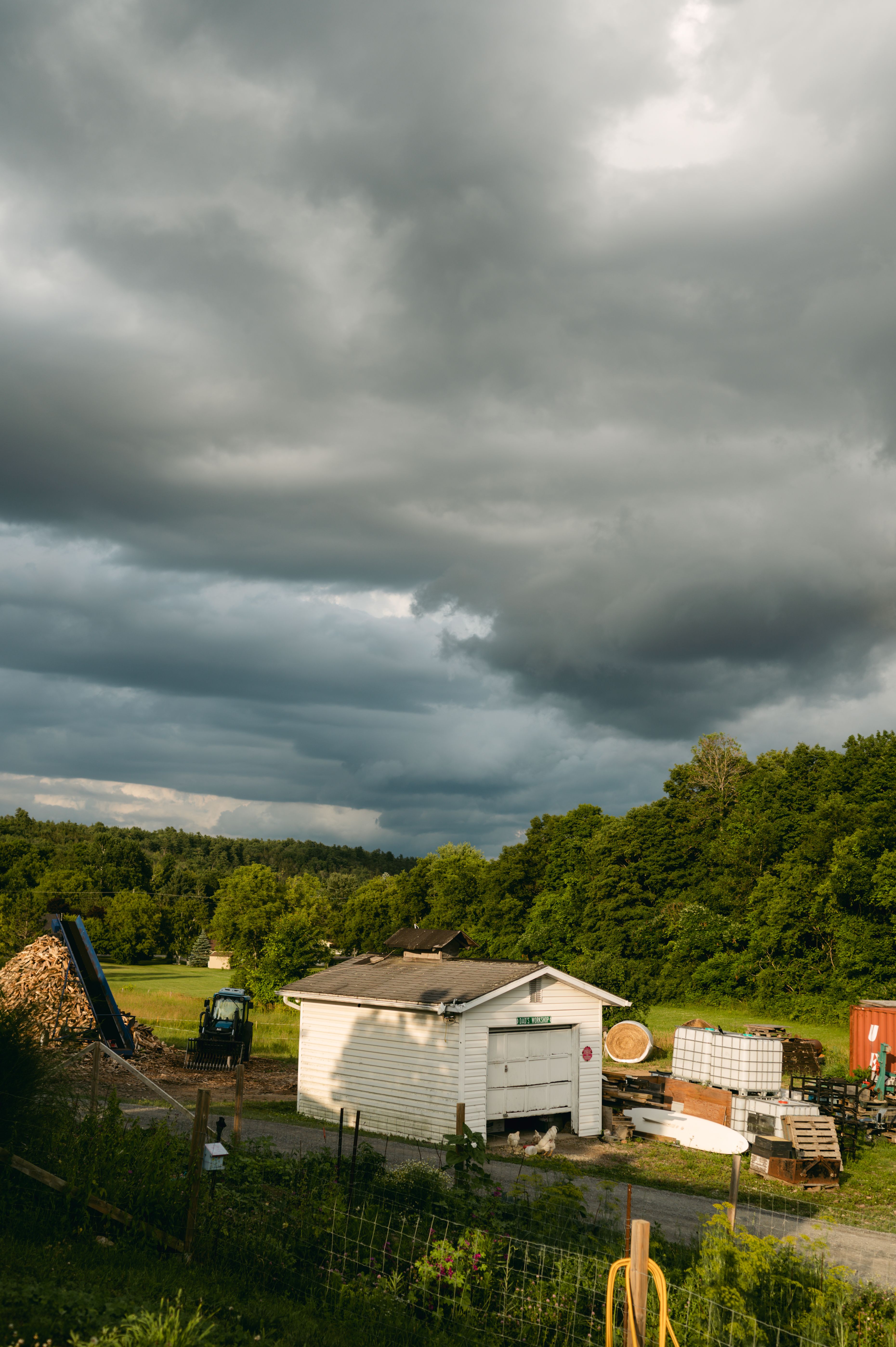 View of a Garage and a Tractor near a Forest in the Countryside · Free ...