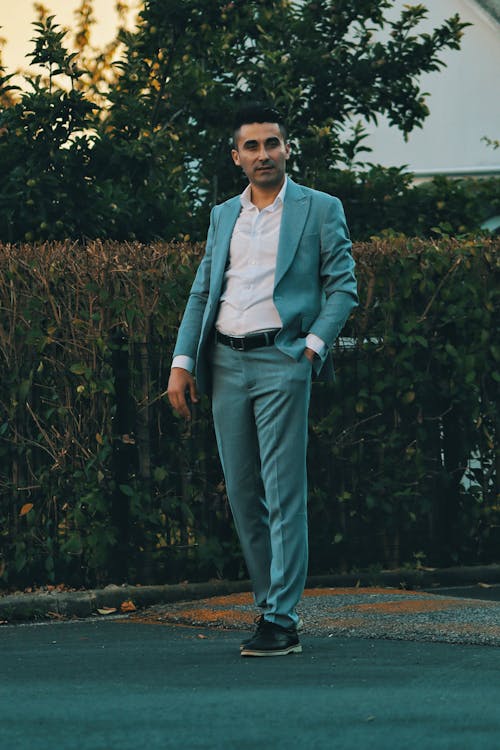 Man in a Suit Standing Outside 