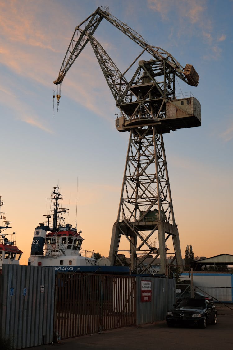 A Crane And Ships In A Port 