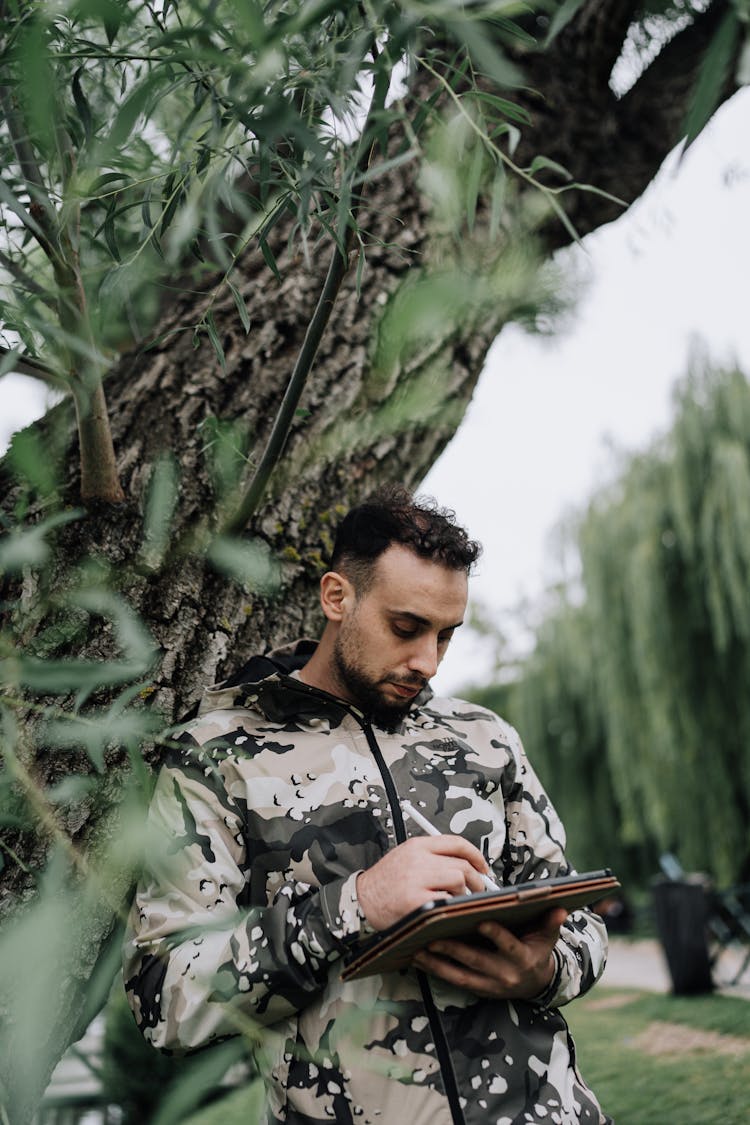 Man Standing With Tablet