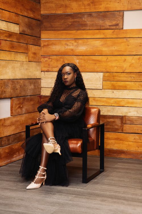 Elegant Woman in a Black Dress and Heels Sitting on a Chair Free Stock Photo Elegant Woman in a Black Dress and Heels Sitting on a Chair Free Stock Photo