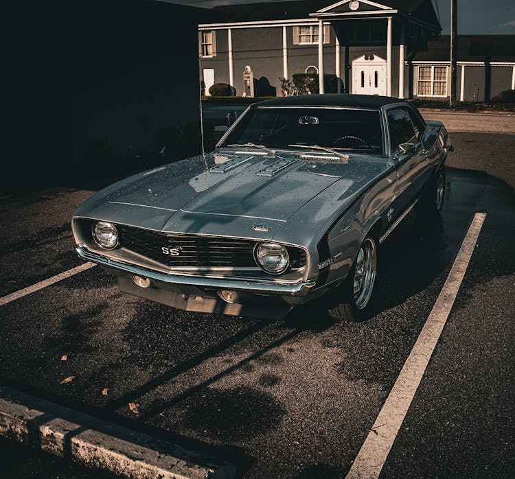 A Vintage Chevrolet Camaro On The Parking Lot 