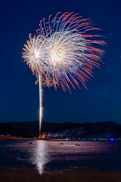 View of Fireworks over a Body of Water 
