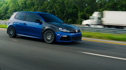 Free A Car Driving on a Road Stock Photo