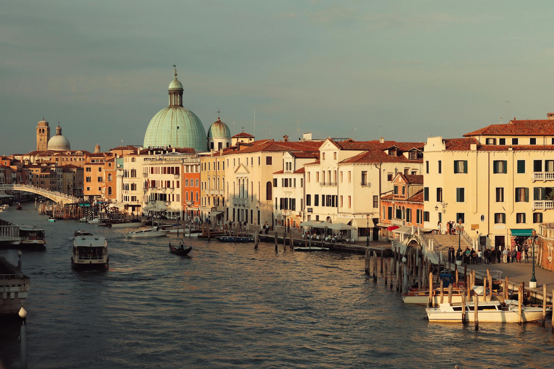 Serene view of the Grand Canal and San Simeone Piccolo at sunset, capturing Venice's charm.