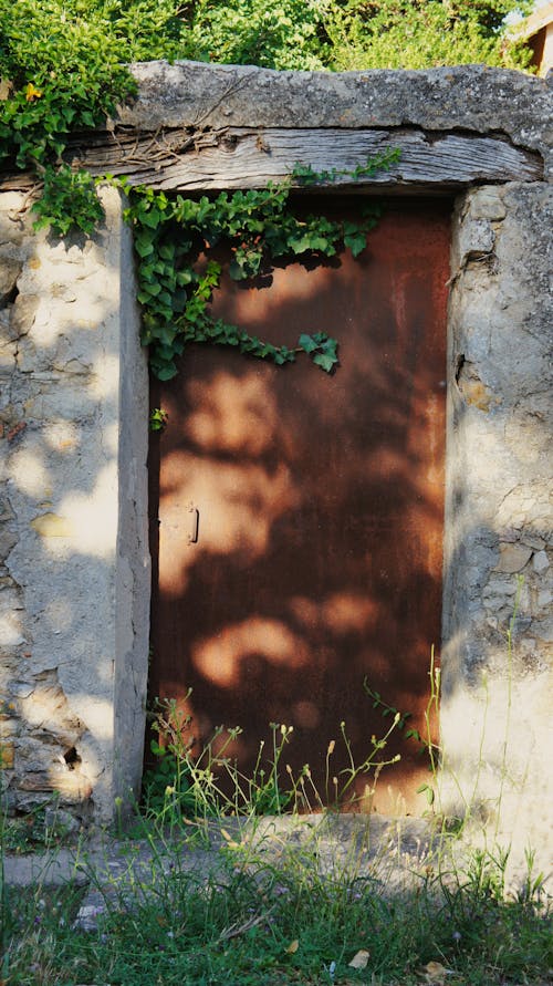 View of Rusty Door in a Broken Building 