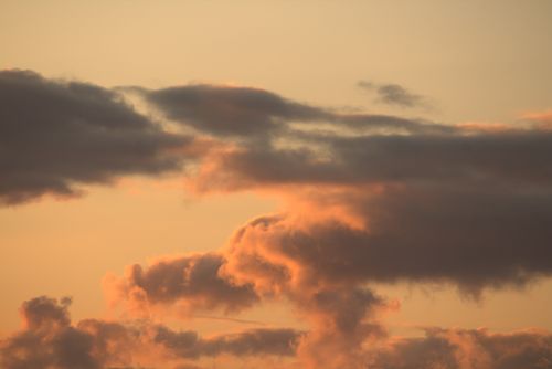 Free Beautiful sunset clouds in Guaratuba, Brazil create a serene sky view. Stock Photo