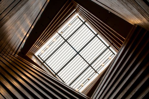 Skylight framed by angled timber slats — photo by Beyzanur K. on Pexels