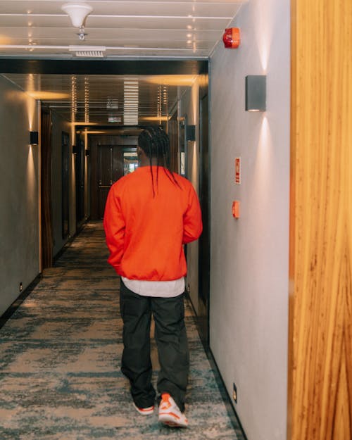 Man Walking on Corridor