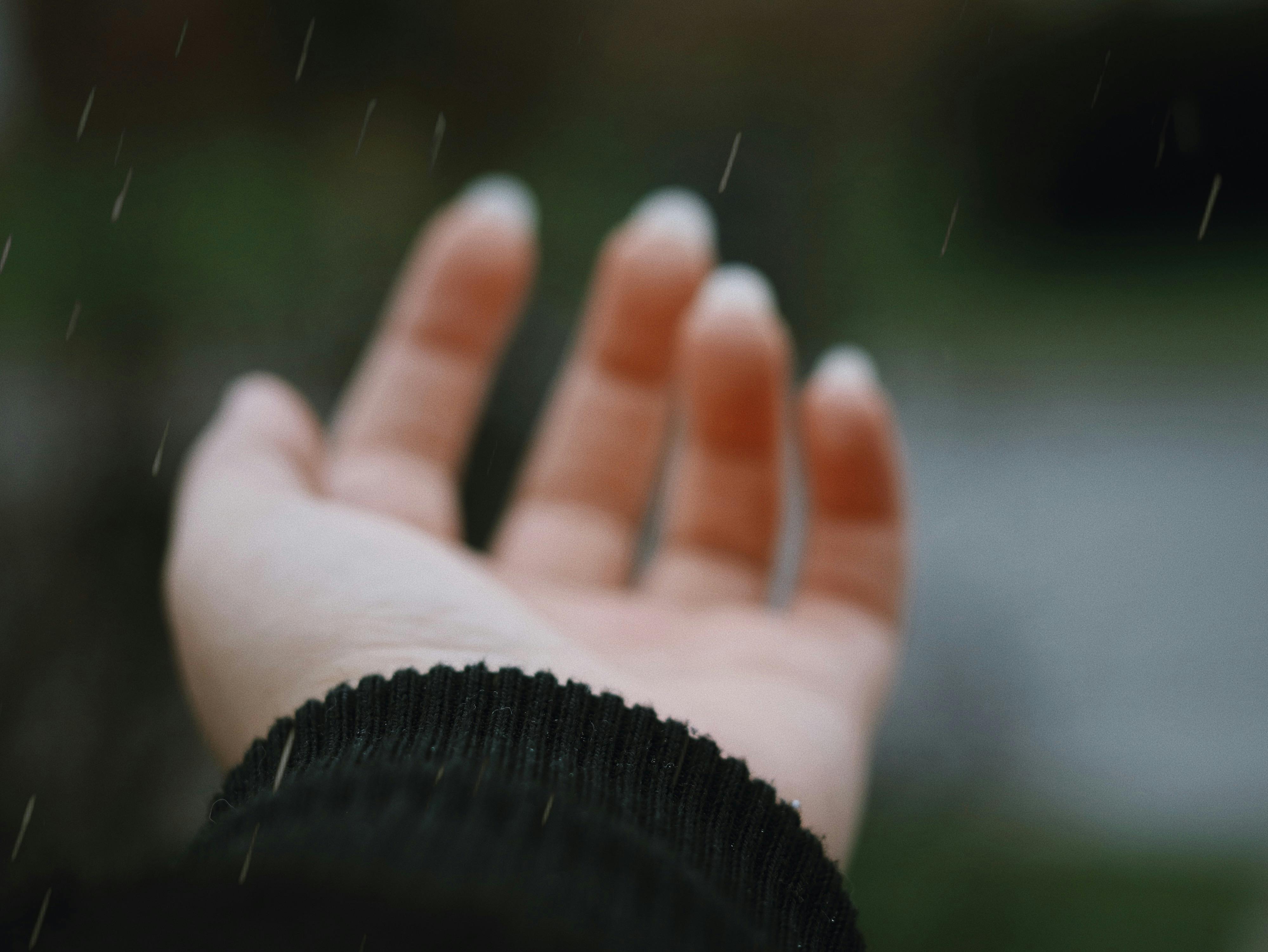 Hand in Rain · Free Stock Photo