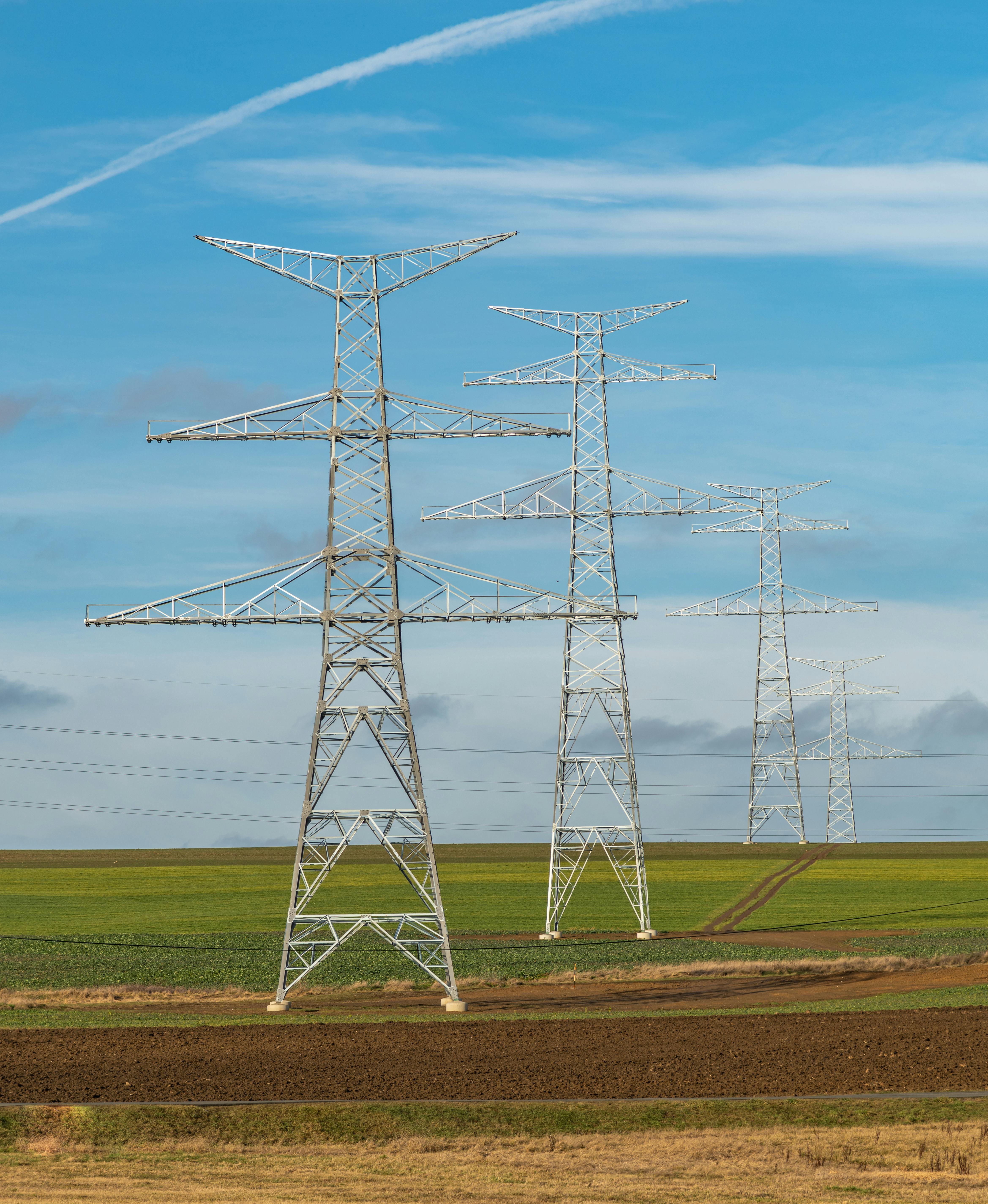 electricity poles on a field