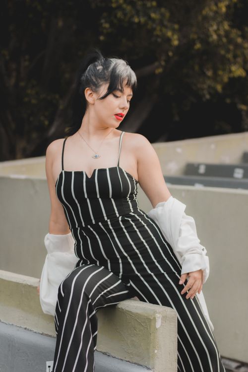 Portrait of a Female Model Posing in Striped Clothing · Free Stock Photo